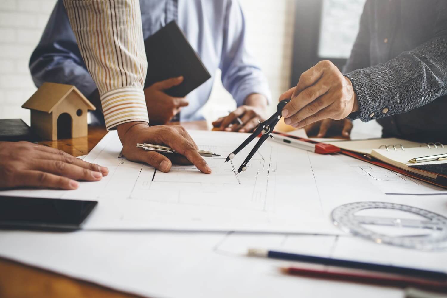 people reviewing blueprints